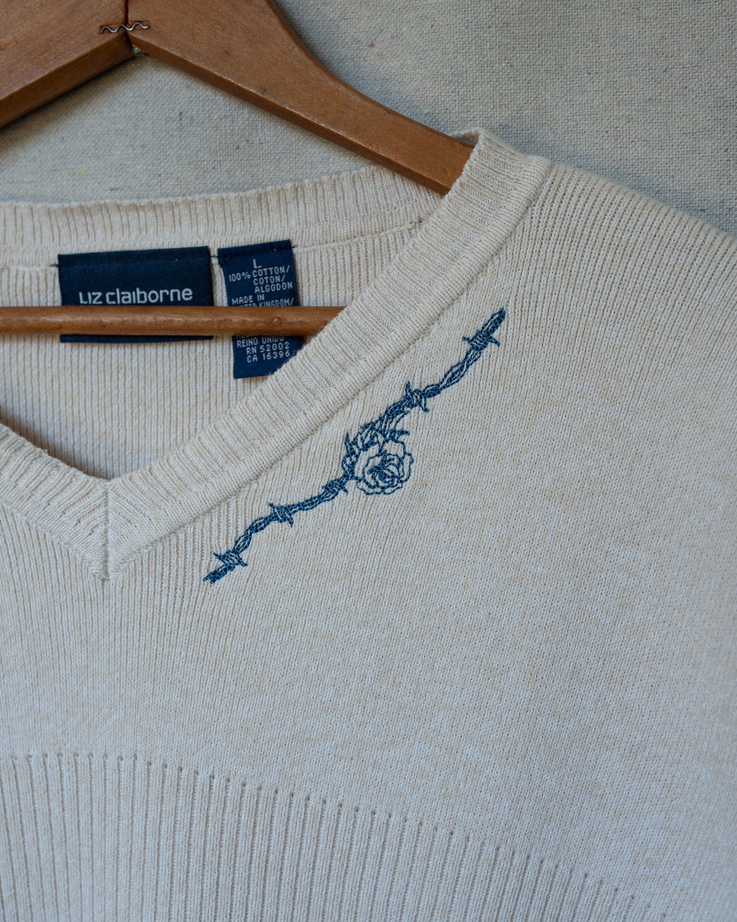 detail of cream knit short sleeve embroidery