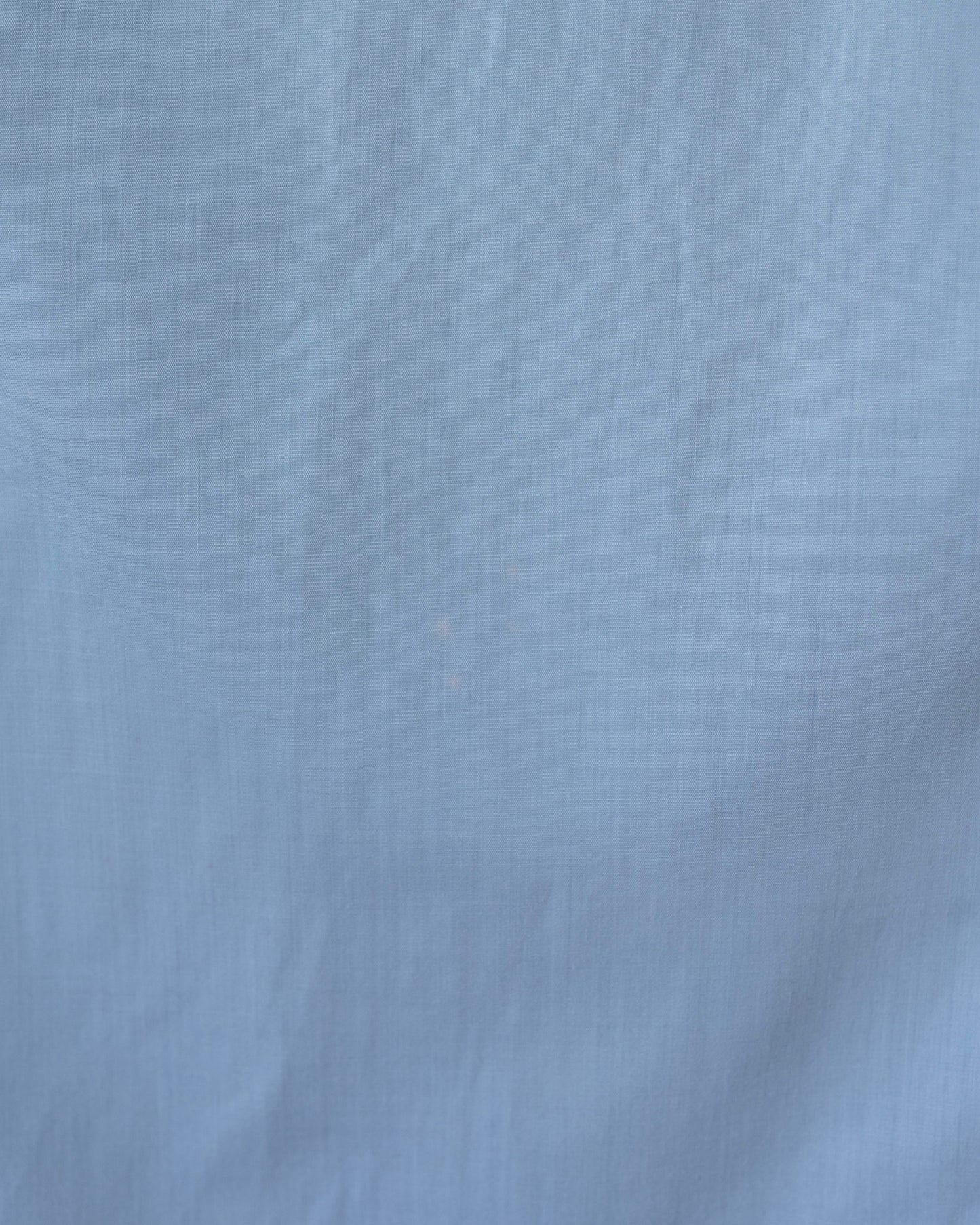Close-up of a light blue fabric texture