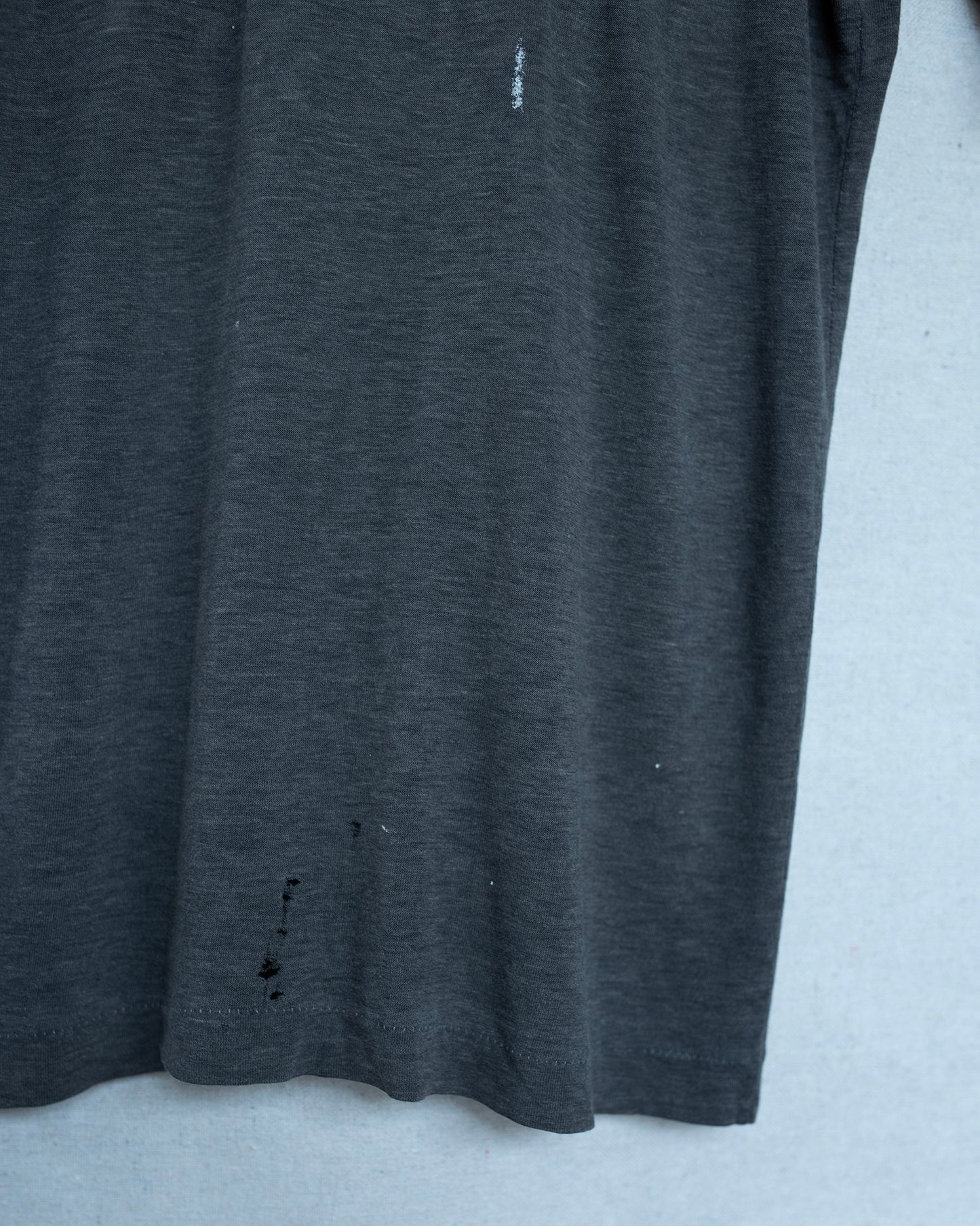 Dark gray t-shirt on a light gray background