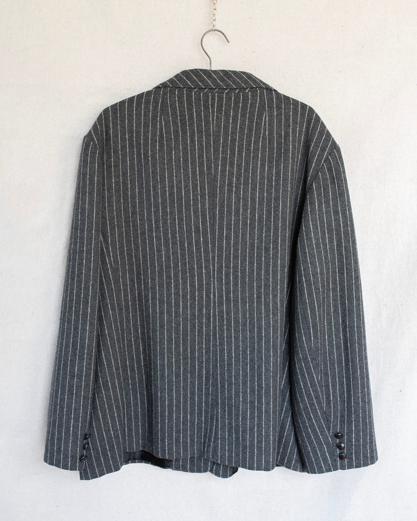 Gray pinstripe blazer on a white background