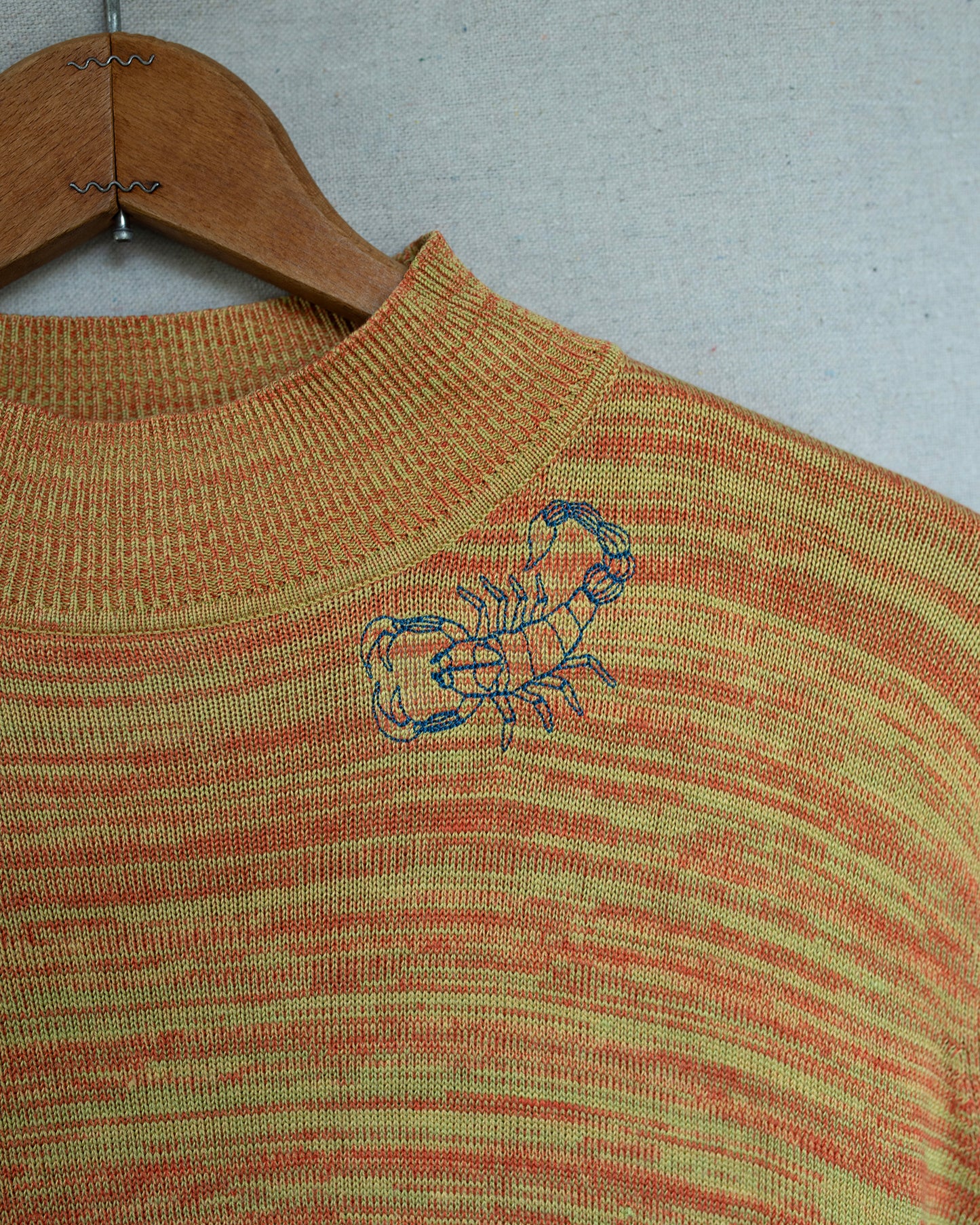 Knit Short Sleeve detailed Scorpion embroidery.