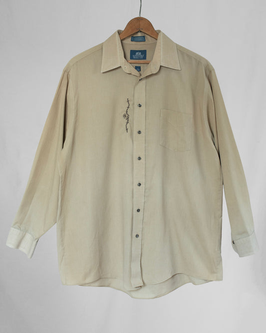Pale yellow long sleeve button down shirt with embroidery.