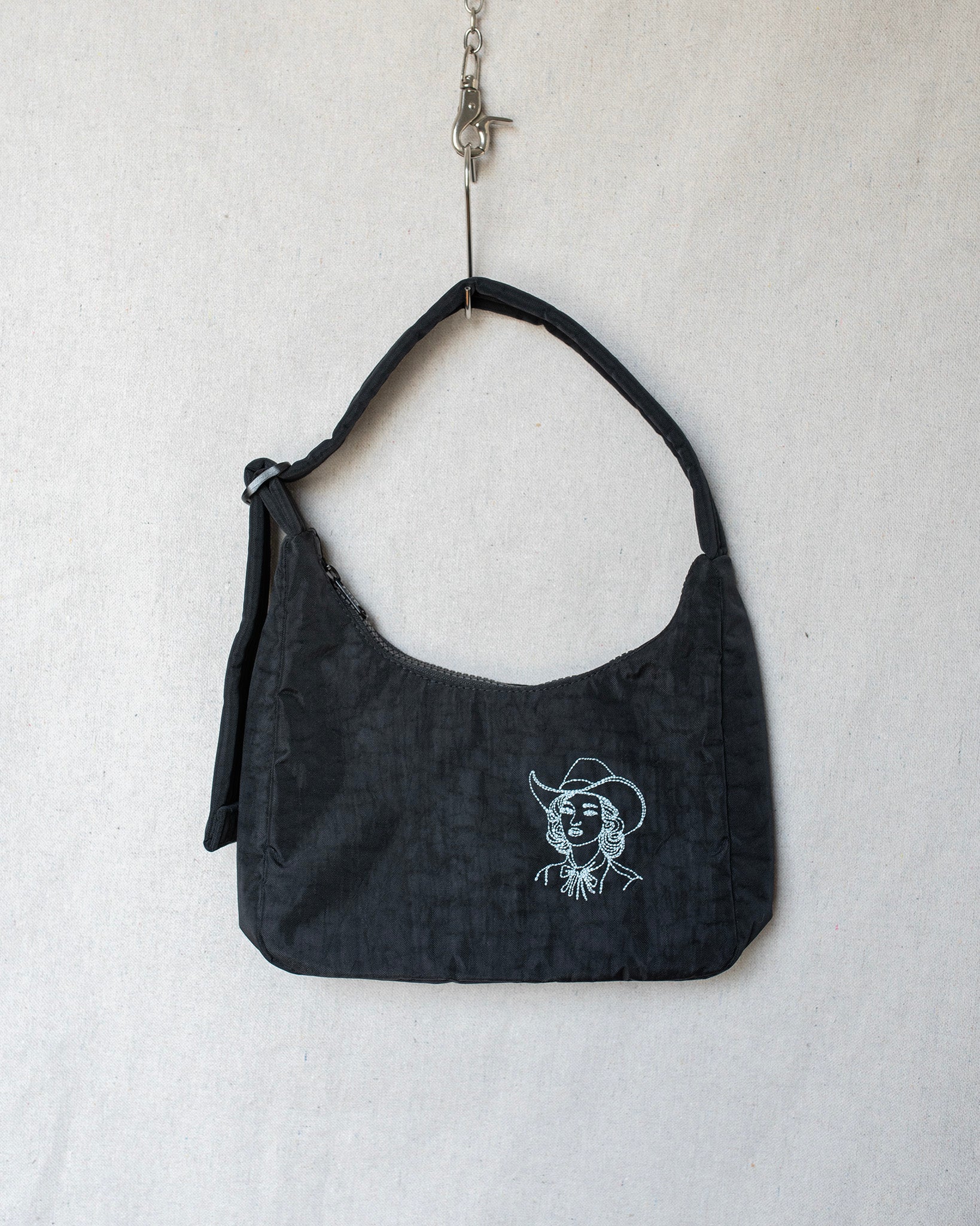 Small black shoulder bag purse with a cowgirl embroidery