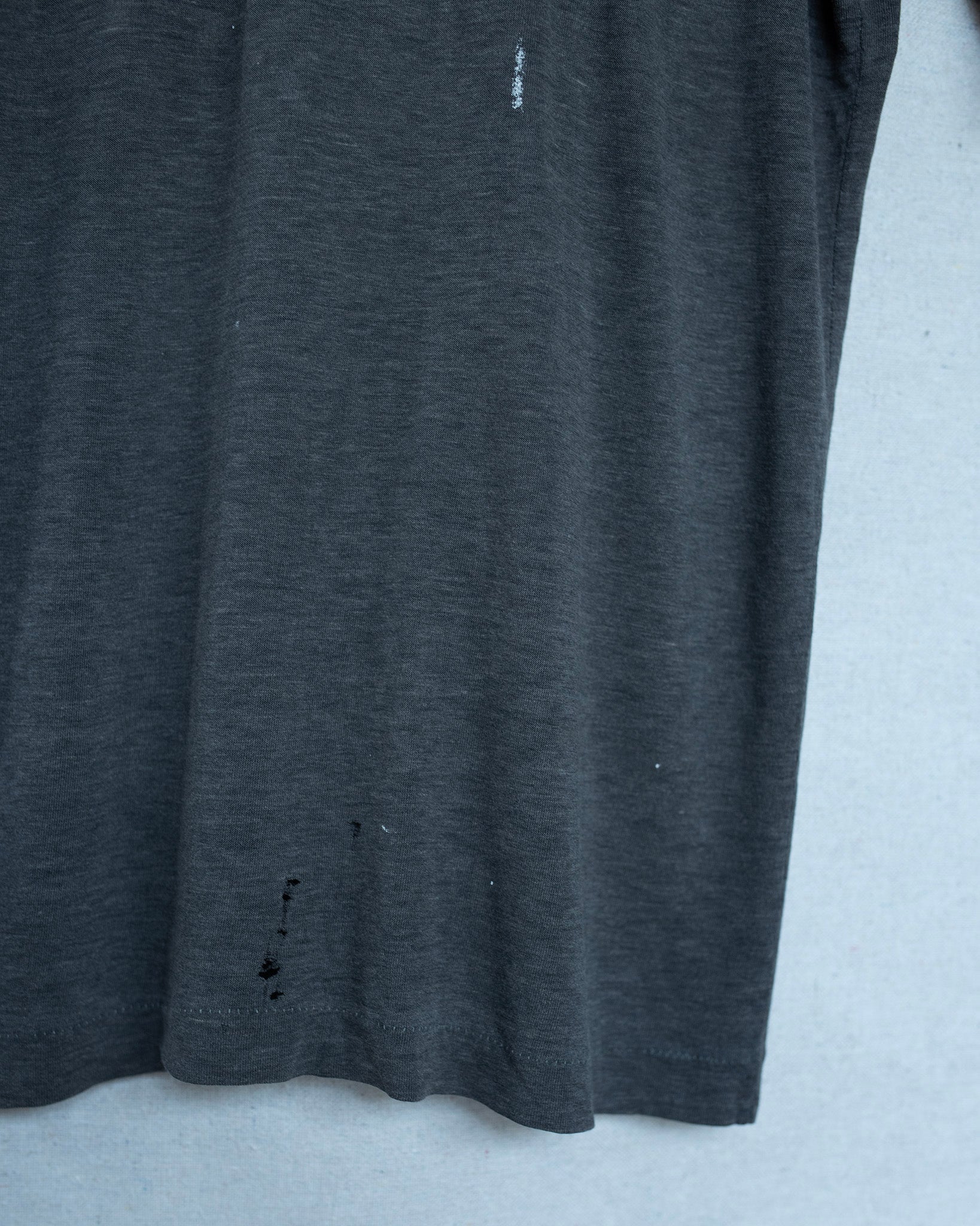 Dark gray t-shirt on a light gray background