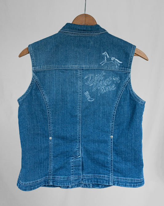 Blue denim vest with embroideries on a white background