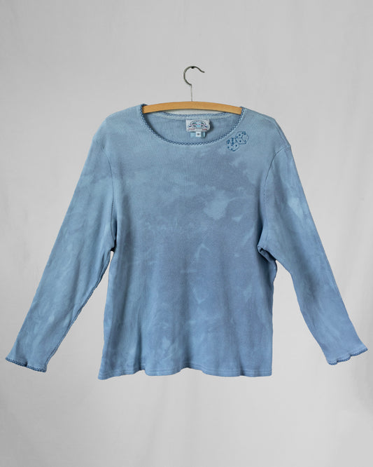 Dyed blue long sleeve with dice embroidery under collar hem.