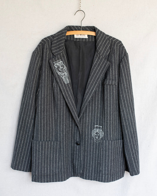 Gray pinstripe blazer with embroidered statues on a white background