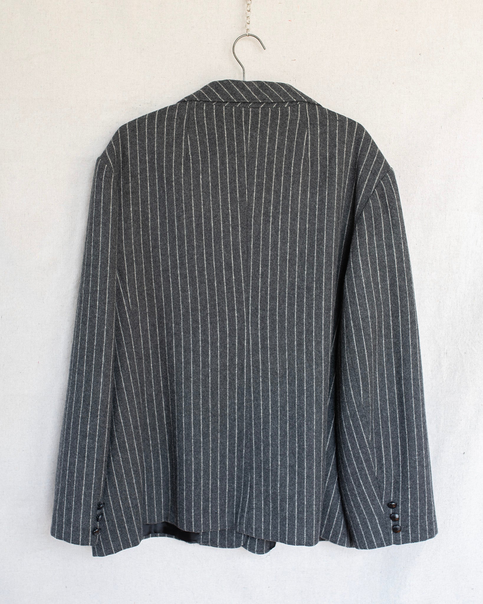 Gray pinstripe blazer on a white background