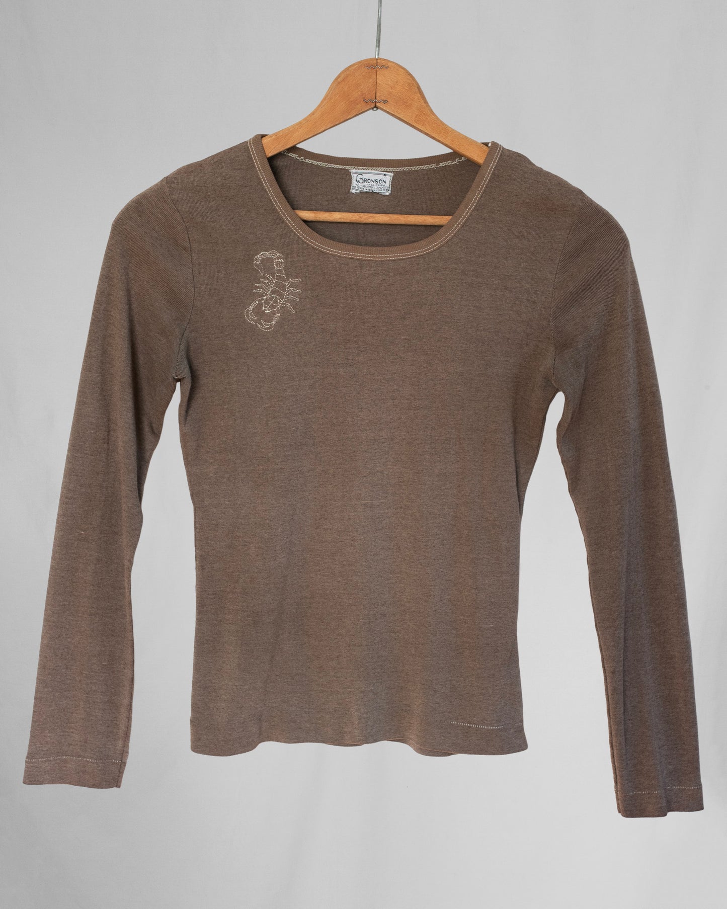 Brown long sleeve shirt with a scorpion embroidery on chest area.