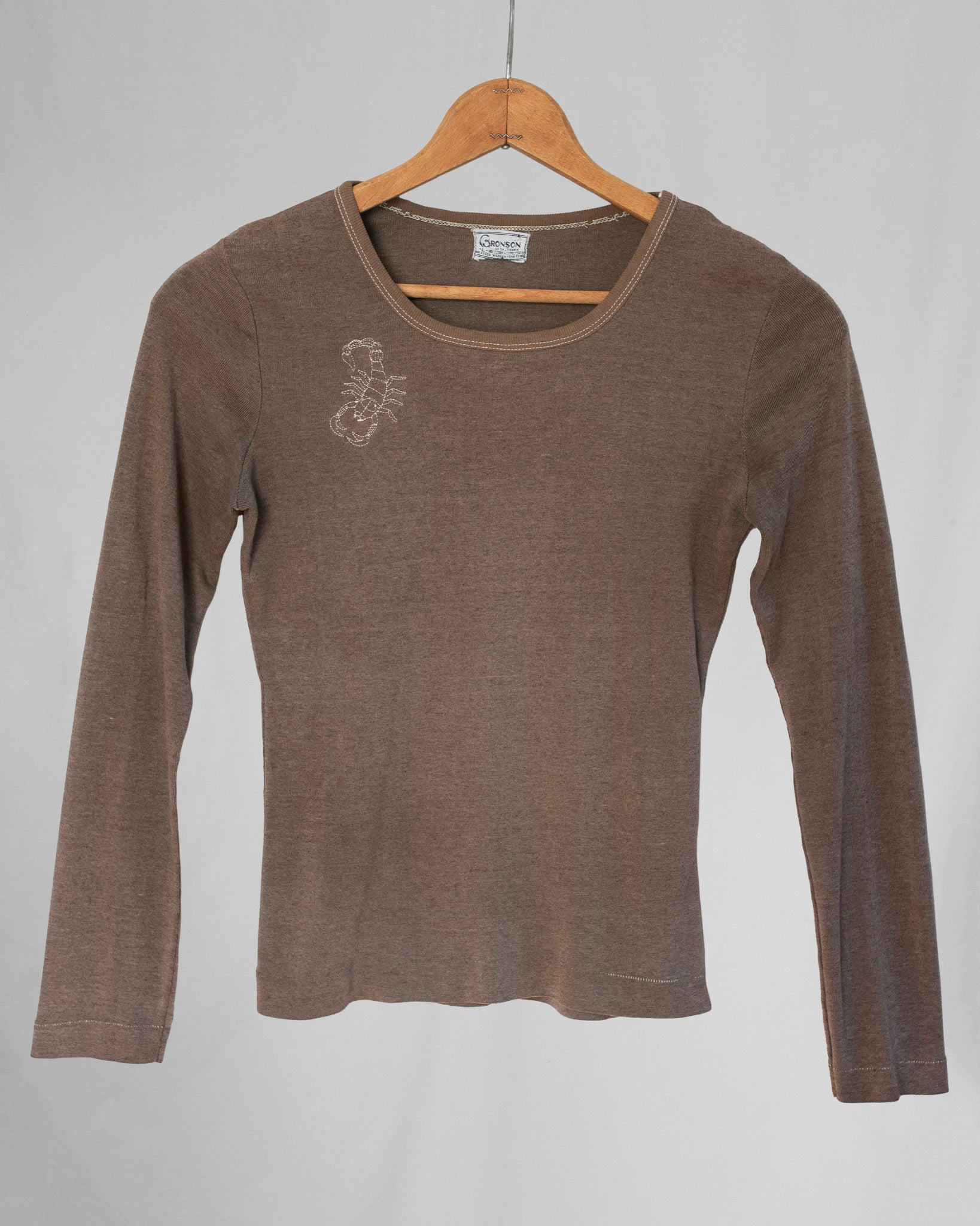 Brown long sleeve shirt with a scorpion embroidery on chest area.