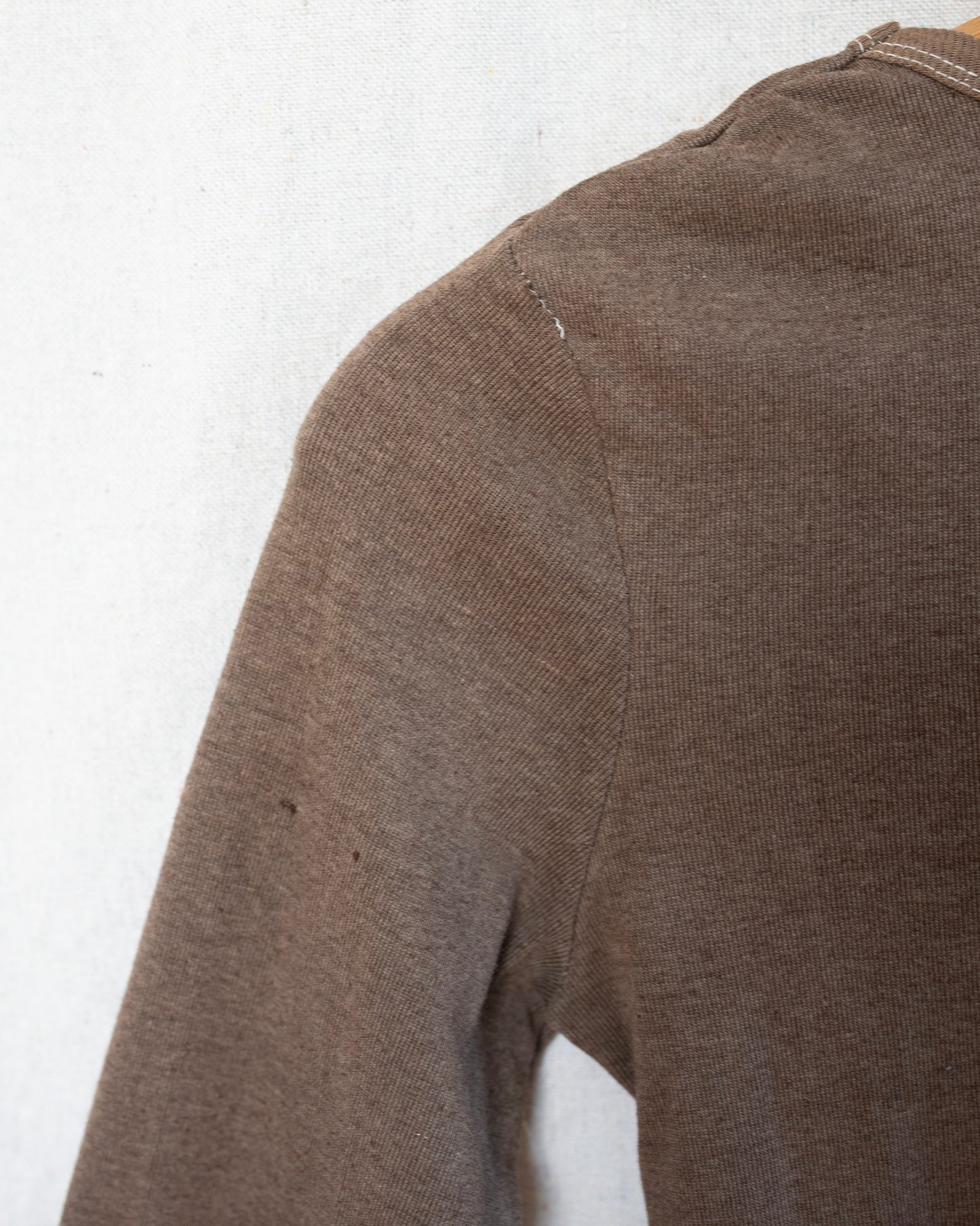 Brown long-sleeve shirt on a white background