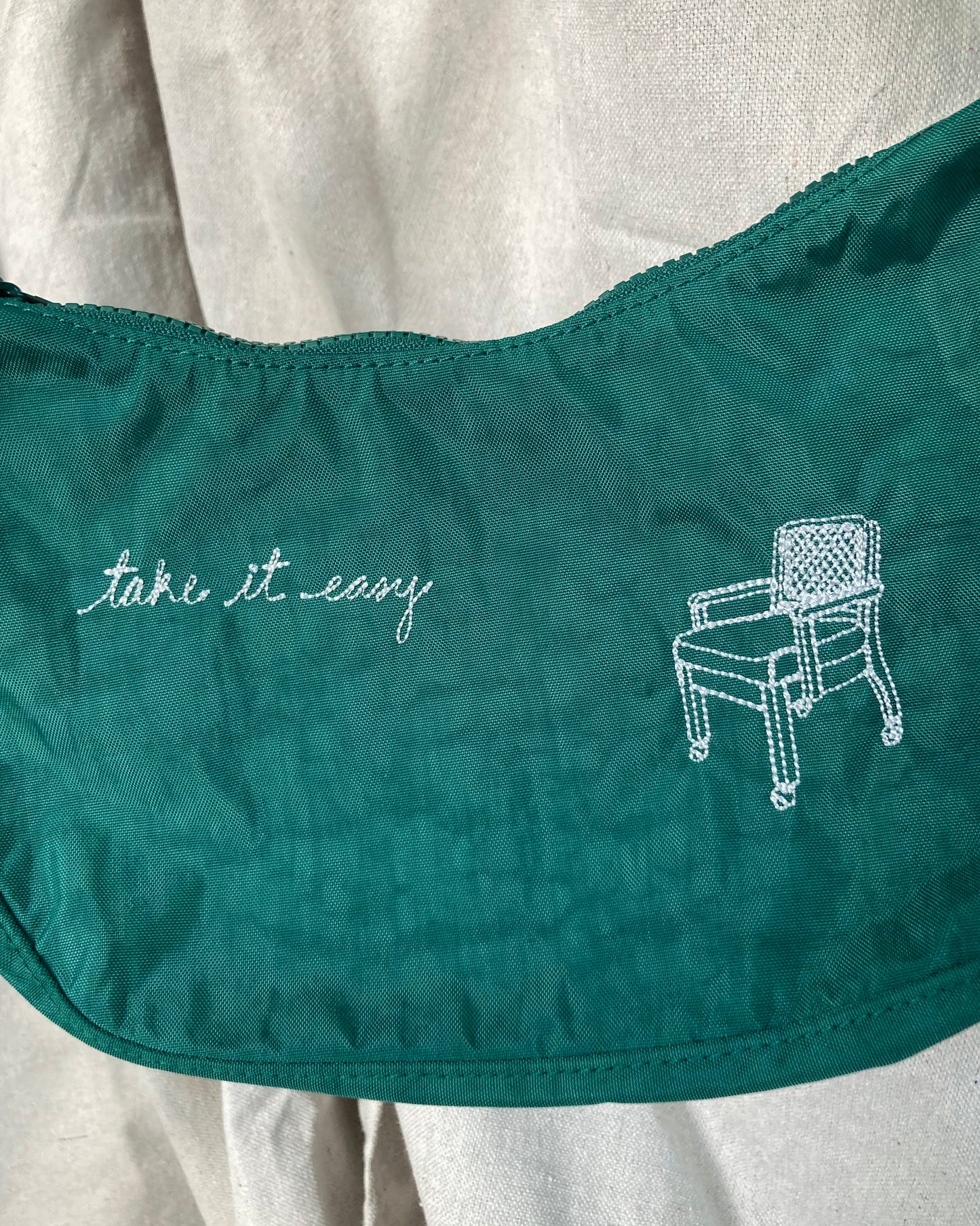 CHAIR WITH "TAKE IT EASY" SMALL CRESCENT BAG